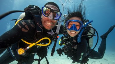 Two smiling divers underwater