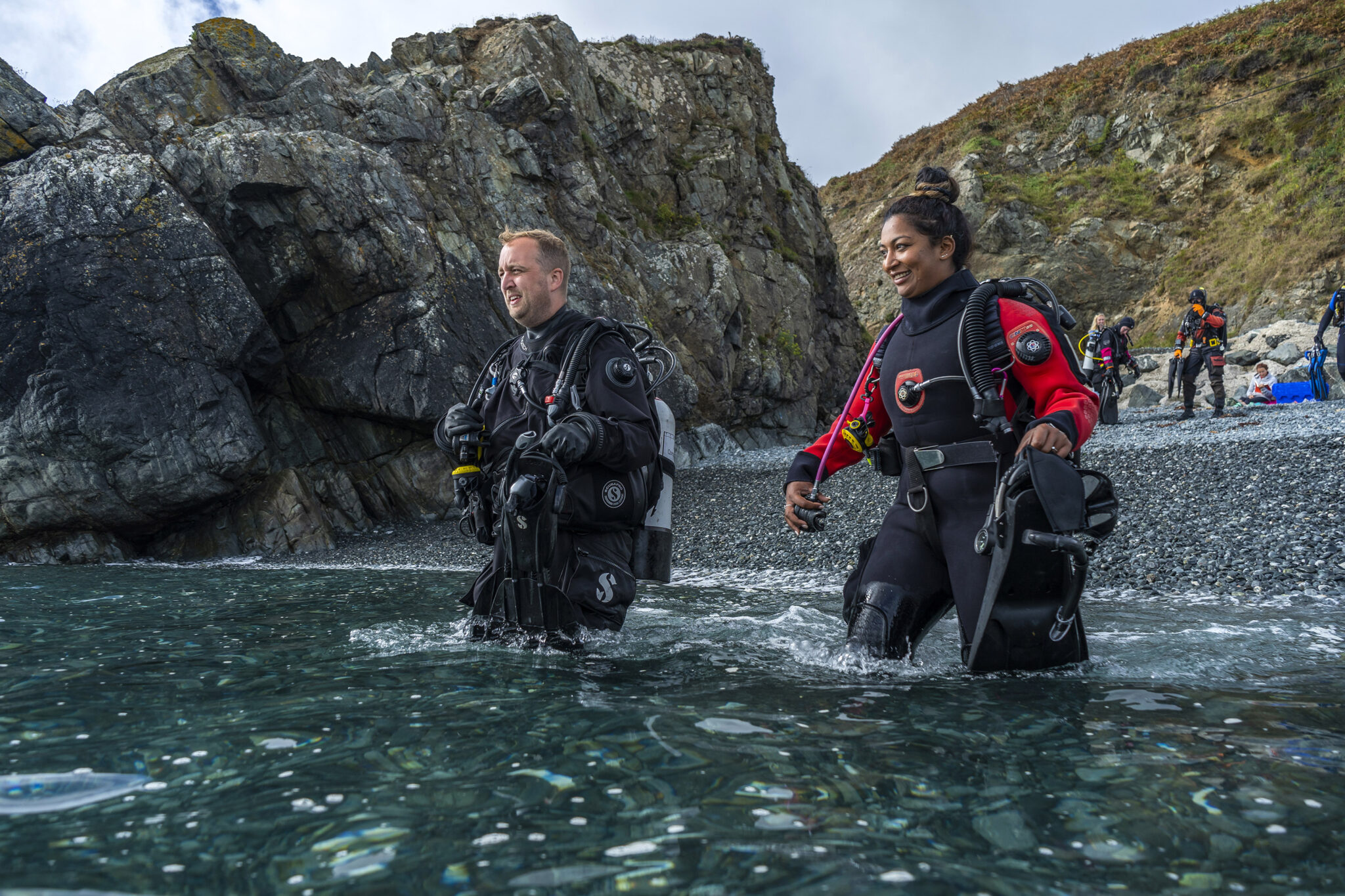 Two drysuit divers begin their PADI scuba course at home in the UK so they can get scuba certified before they go on vacation