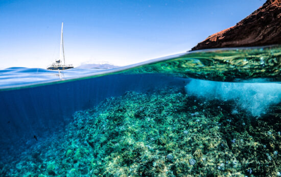 destinations for freediving split shot underwater sailboat in france