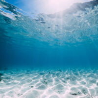 shallow water with light rays coming through