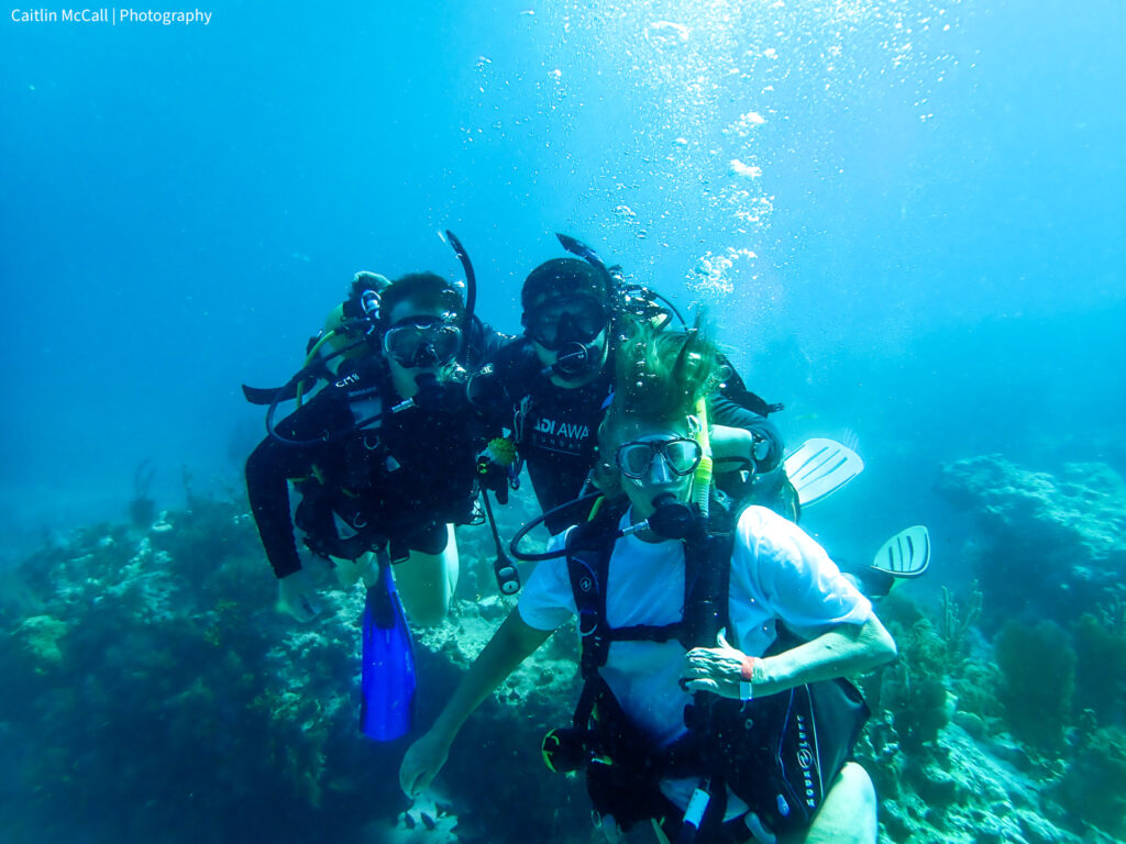 Three divers underwater in the Florida Keys