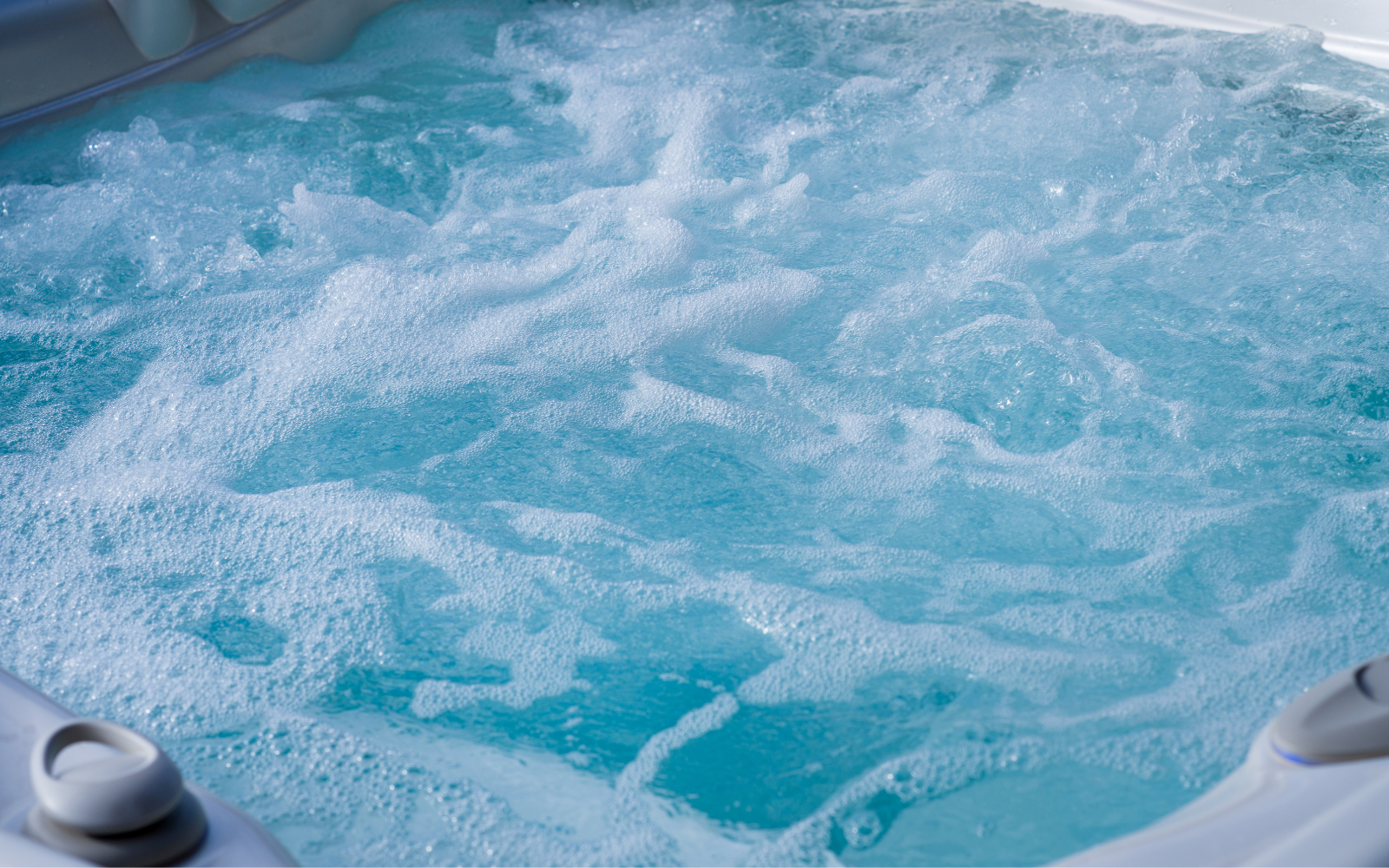 Bubbly water swirls in a hot tub, a feature often found on liveaboards but should not be used directly after exiting a dive