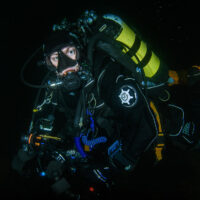 Ross McLaren underwater in Scotland wearing dry suit.