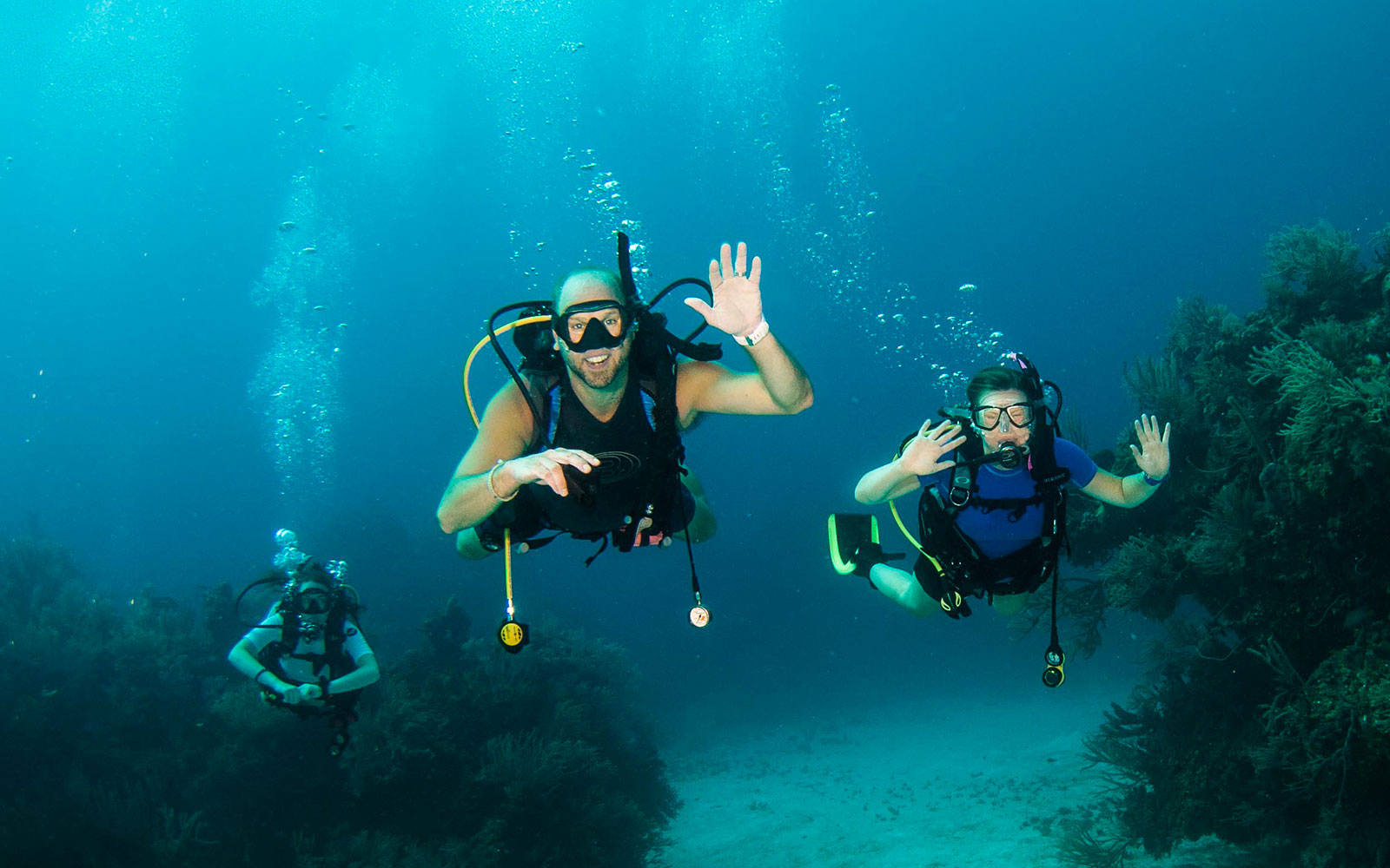 PADI Course Director and AmbassaDiver Thomas Koch and his daughter Claire diving and building underwater connections together