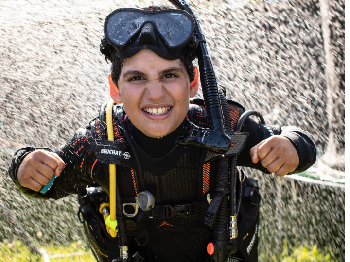 A young diver, Nedal, is part of the Aliquam 3 dive series, which helps kids discover scuba diving and Live Unfiltered