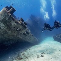 divers exploring a wreck
