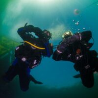 Two drysuit divers in Vobster, UK
