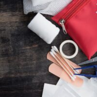 First aid medical kit on wood background,copy space,top view