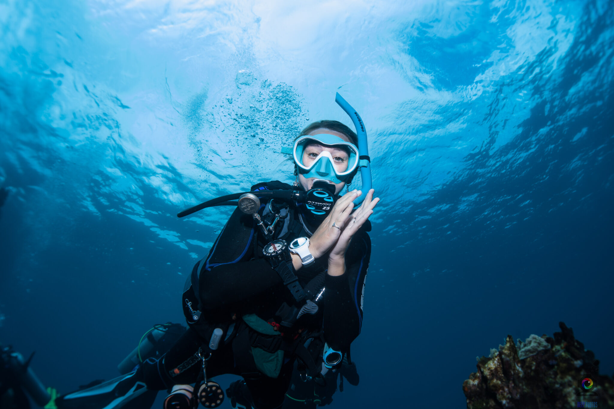 Woman diver looking at the camera underwater
