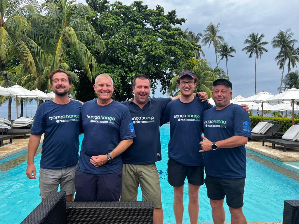 becoming a padi pro group photo by pool