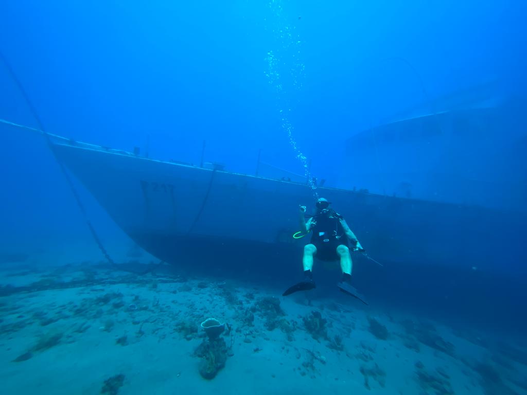 east timor new shipwreck diver with sunken boat 