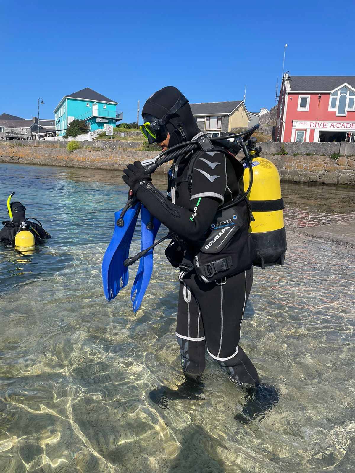 padi reactivate diver walking to shore