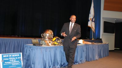 Les Burke speaking at a conference