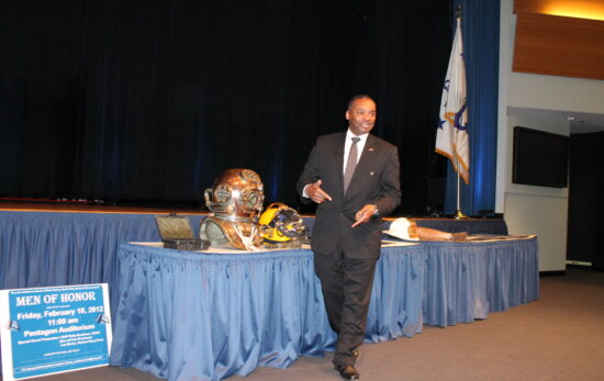 Les Burke speaking at a conference