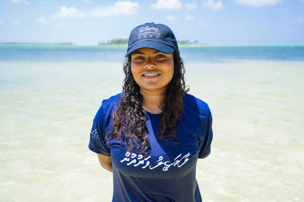 Shaha Hashim stands in front of the ocean in the Maldives