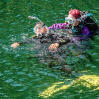 a rescue diver practices towing another diver