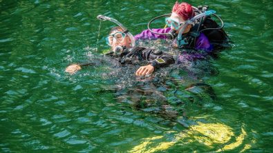 a rescue diver practices towing another diver