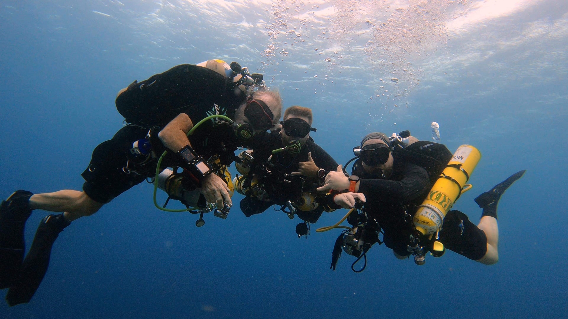 Three tec divers hang out in Bonaire