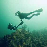 two divers explore the underwater world in the UK
