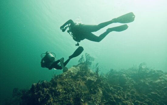 two divers explore the underwater world in the UK