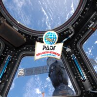 an open water scuba instructor patch in space