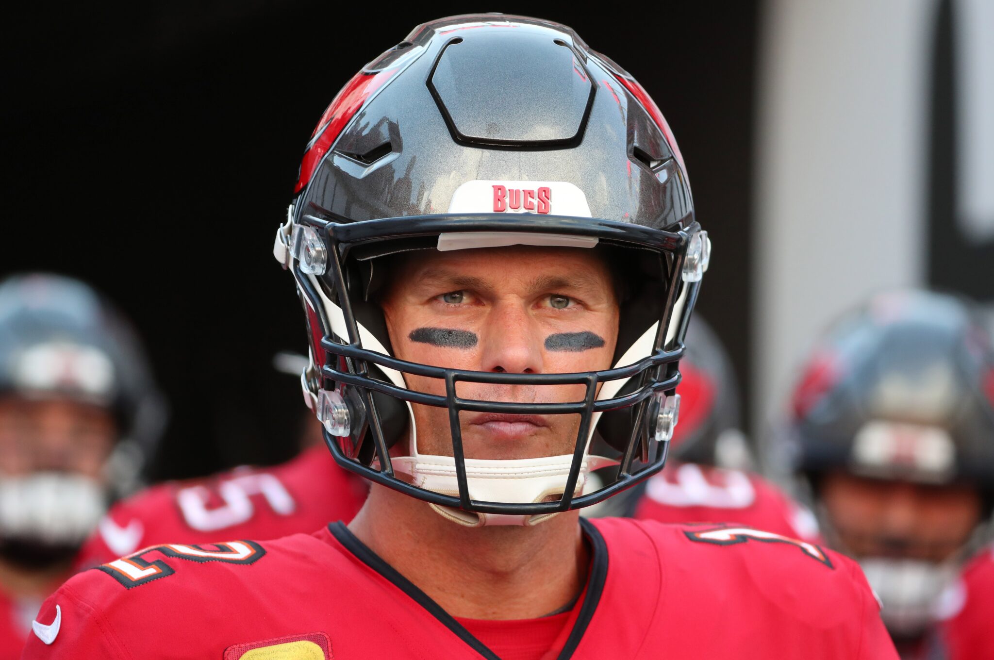 Tom Brady looks at the camera wearing his NFL helmet for the Tamba Bay Buccaneers