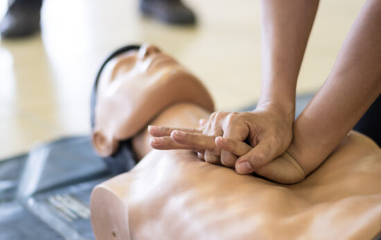 A person practices cpr on a dummy