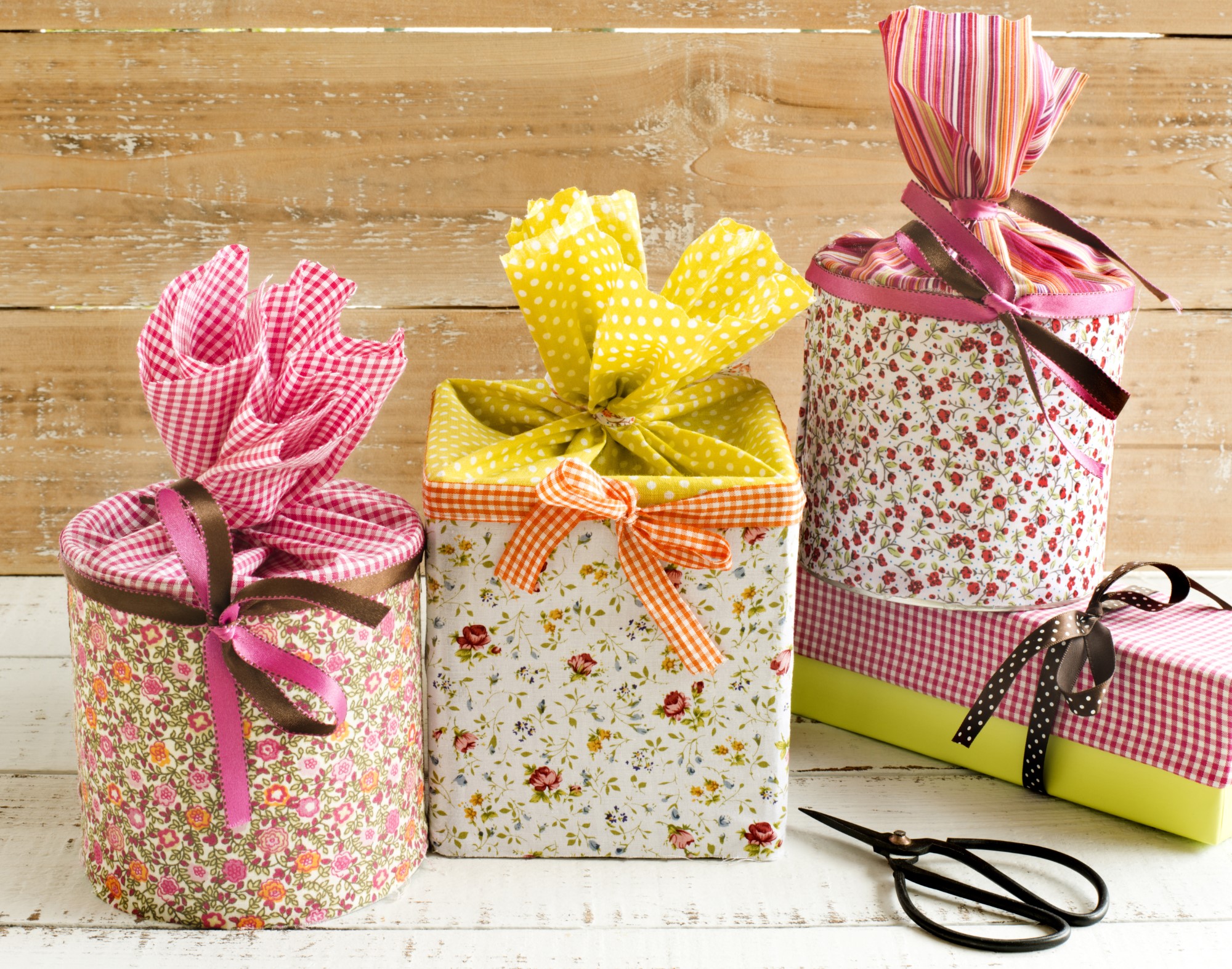 three gifts wrapped in fabric