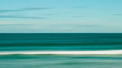 an artwork showing the ocean in teal
