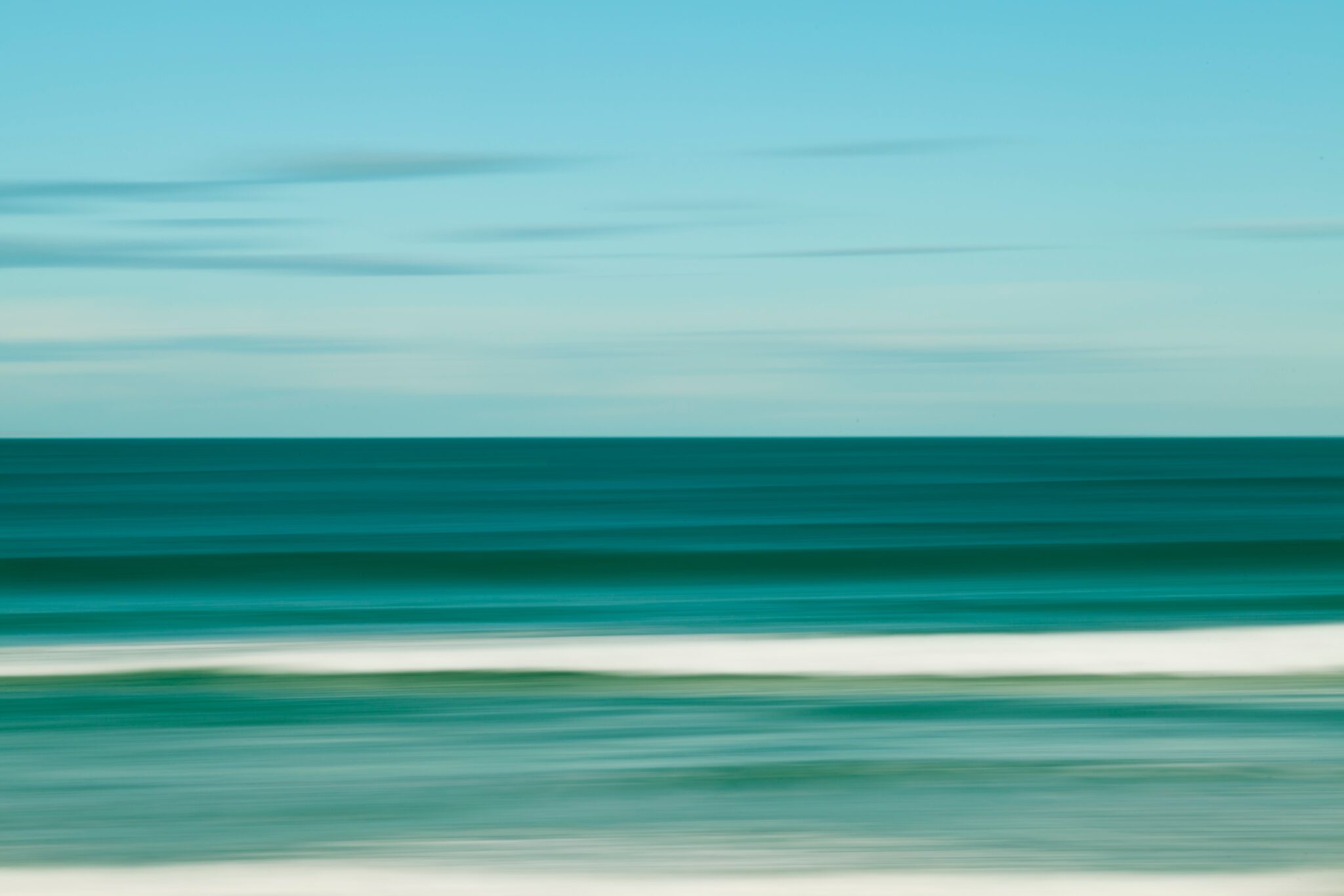 an artwork showing the ocean in teal