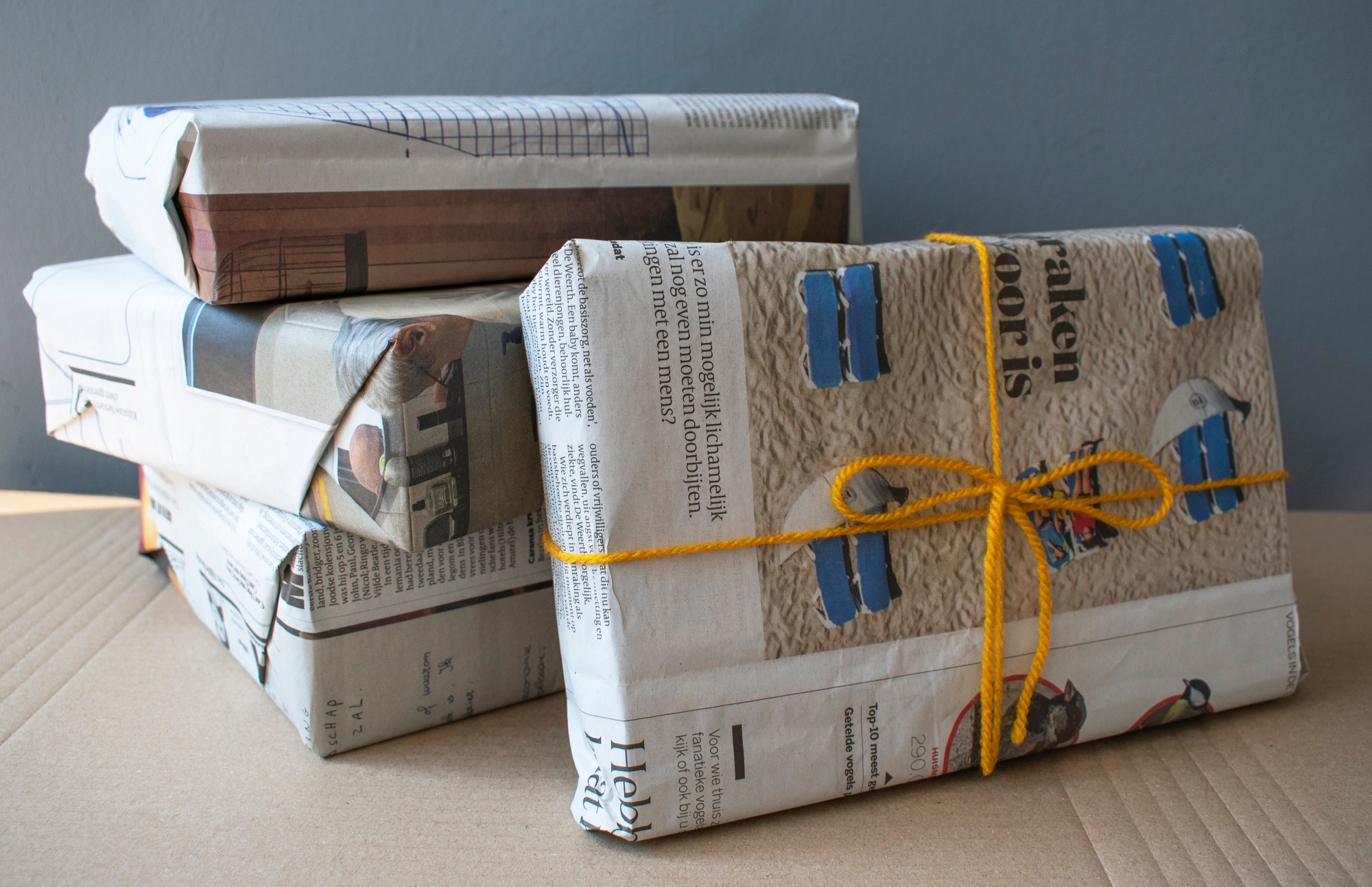 gifts wrapped in newspaper - a recyclable alternative to gift wrap