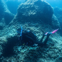 A woman explores the underwater world on scuba in Spain