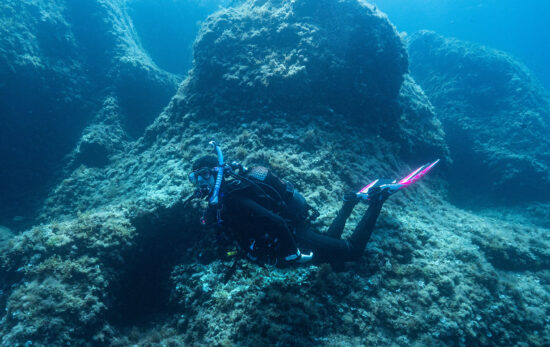A woman explores the underwater world on scuba in Spain