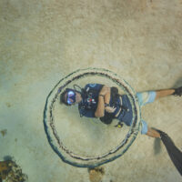 Diver blowing rings underewater