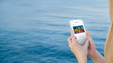 person looking at a cert card on a smartphone
