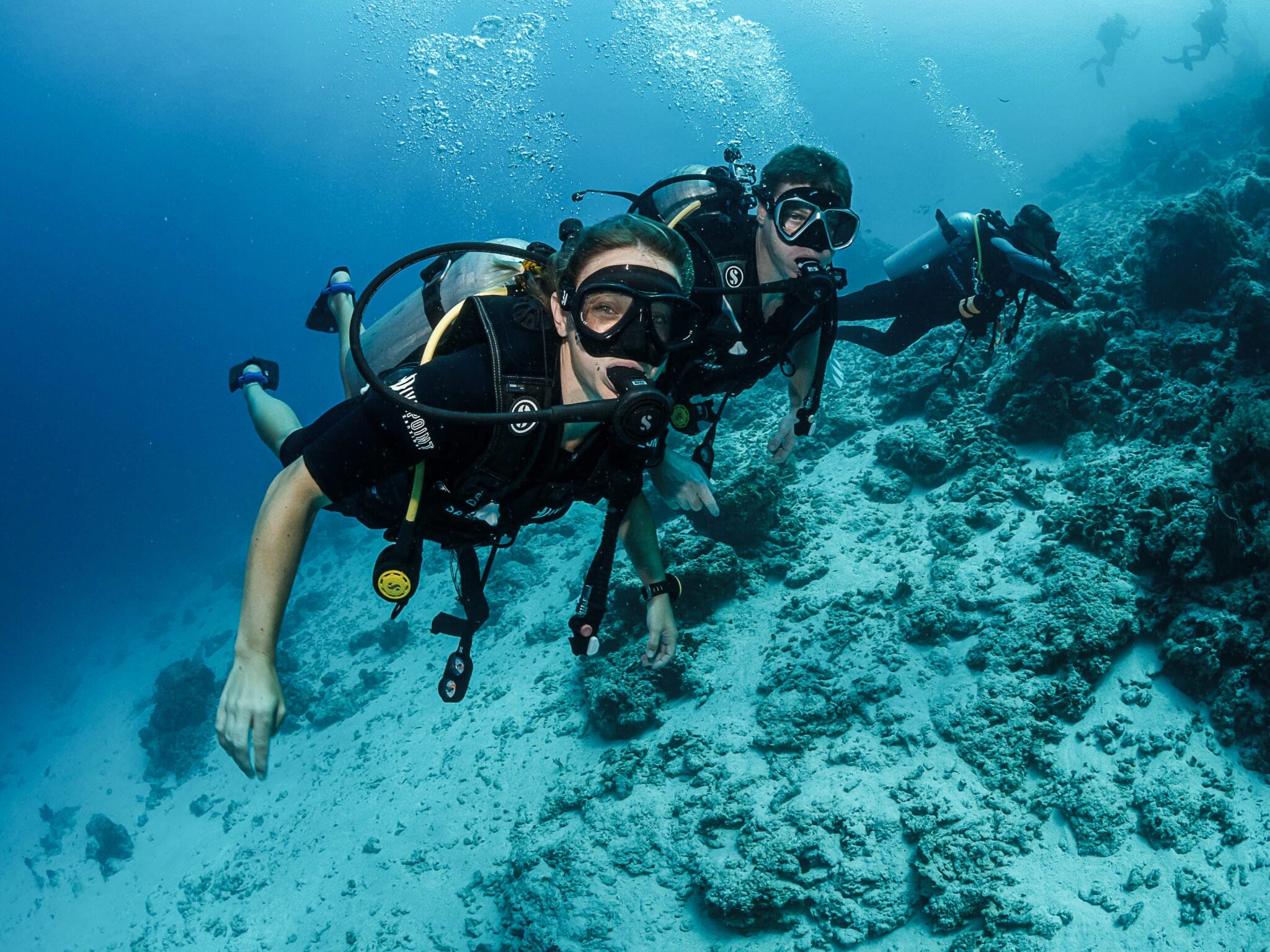 Mary Hannah and her partner underwater; both PADI AmbassaDivers '24