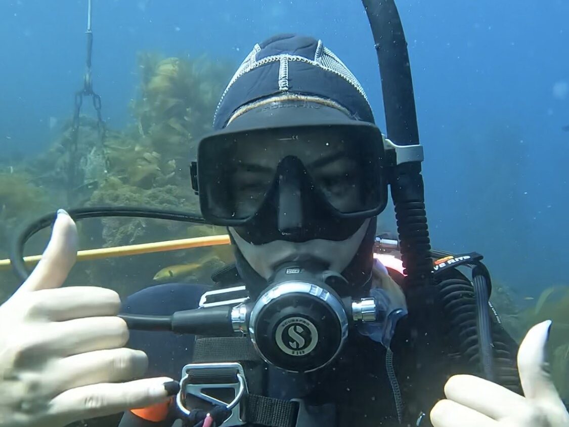 Pacha Light enjoying her first experience breathing underwater in the ocean during her PADI Open Water Diver course.