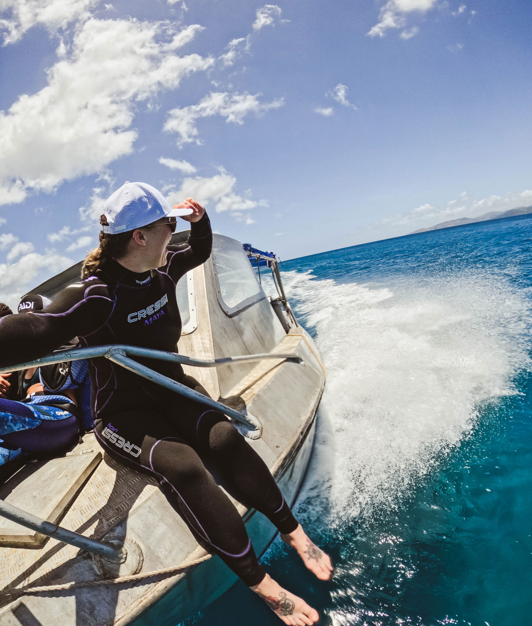 diver taking selfie on front of boat