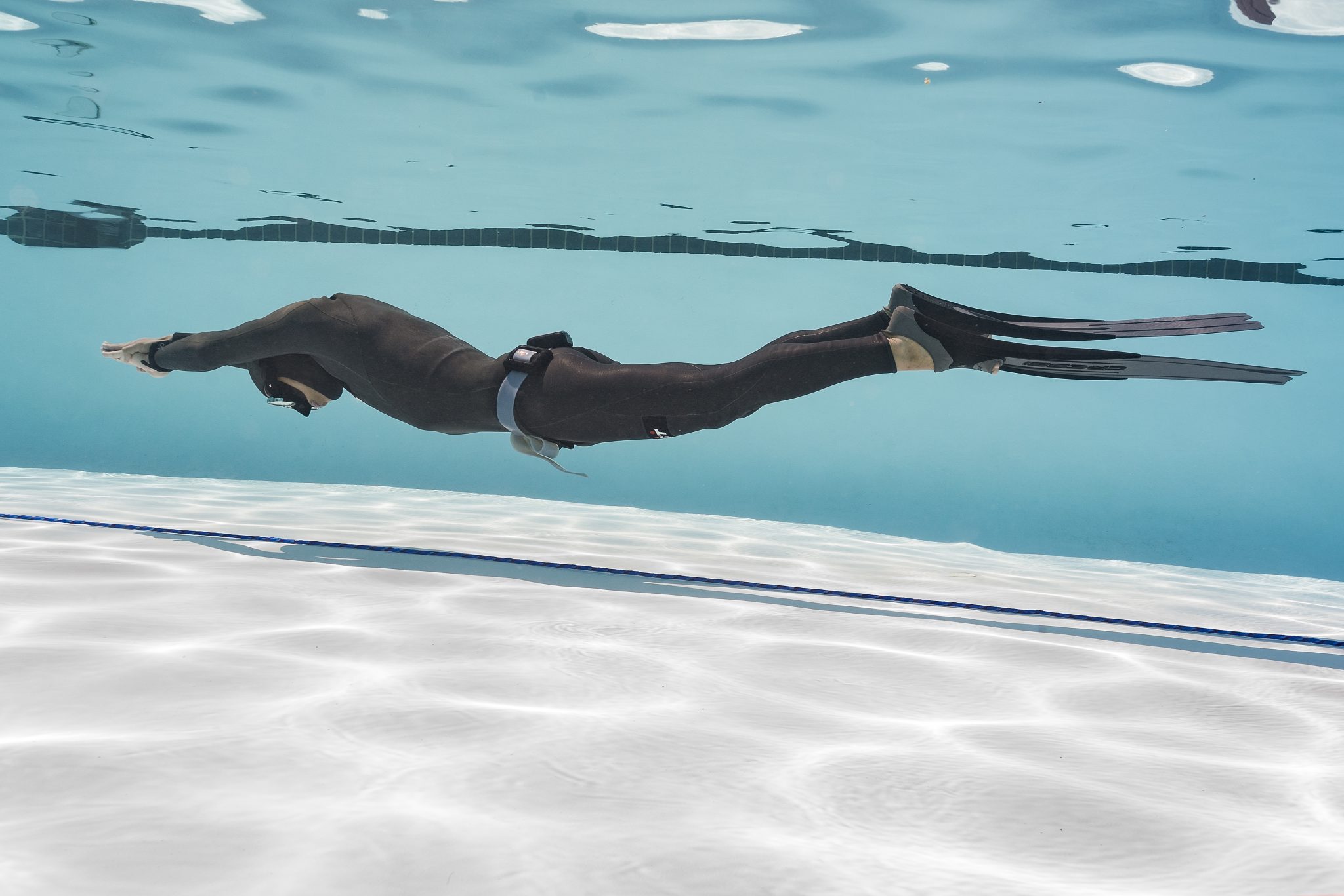a freediver doing dynamic apnea in the pool