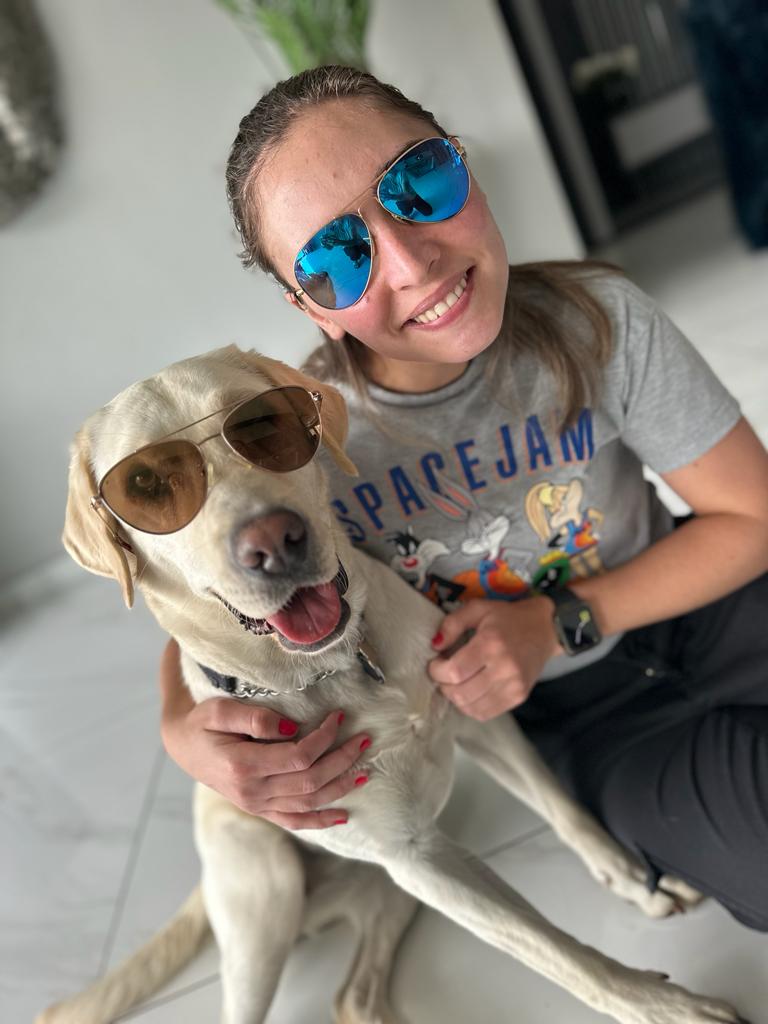 Jessica Pita with her dog both wearing sunglasses