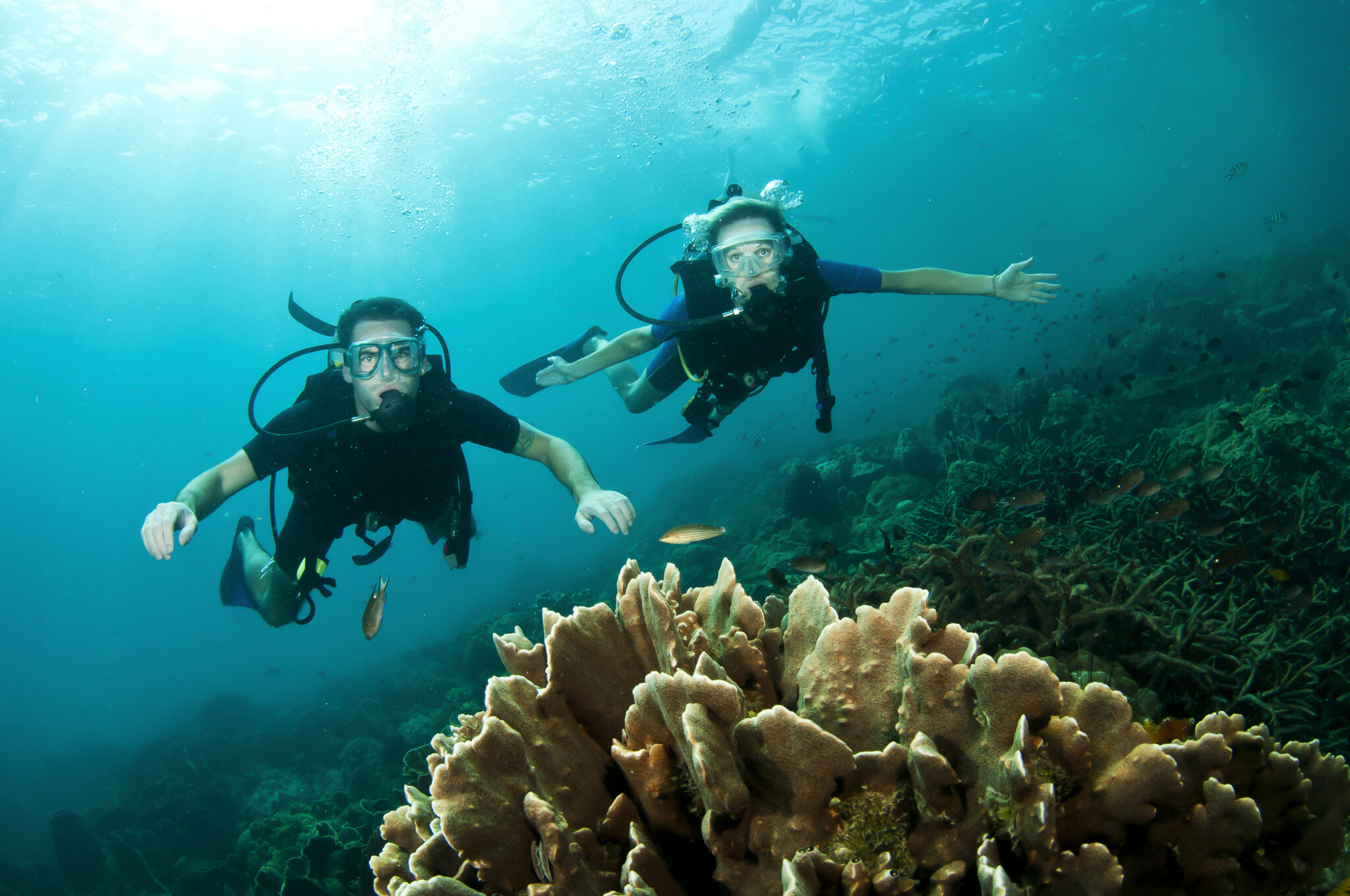 two young divers on their open water dives with PADI