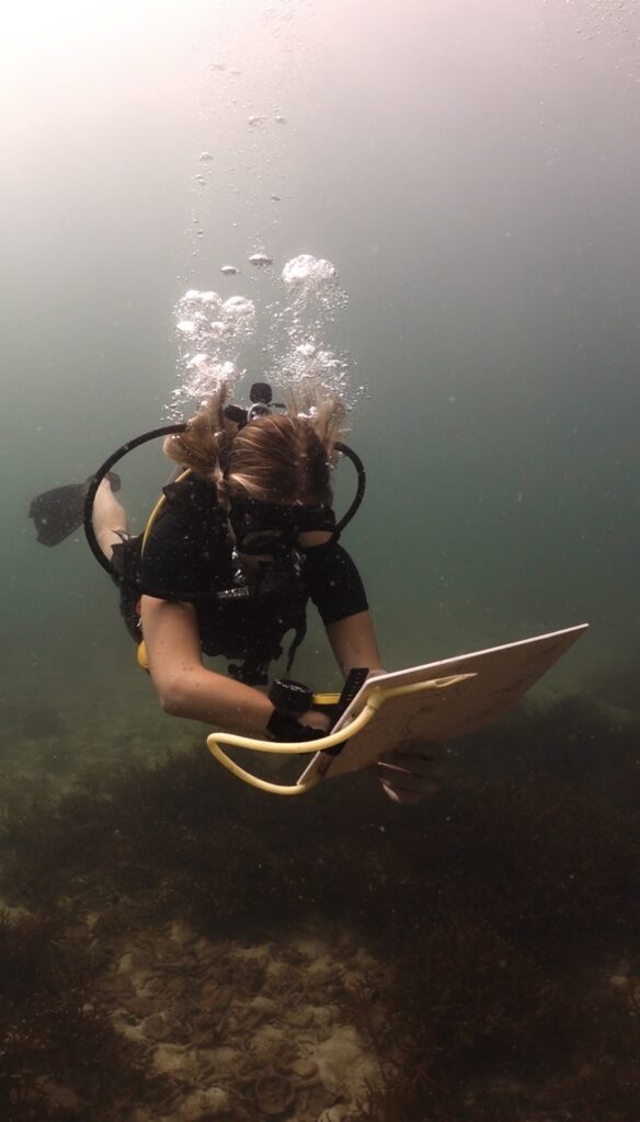 Katie Leeper nagivates underwater. 