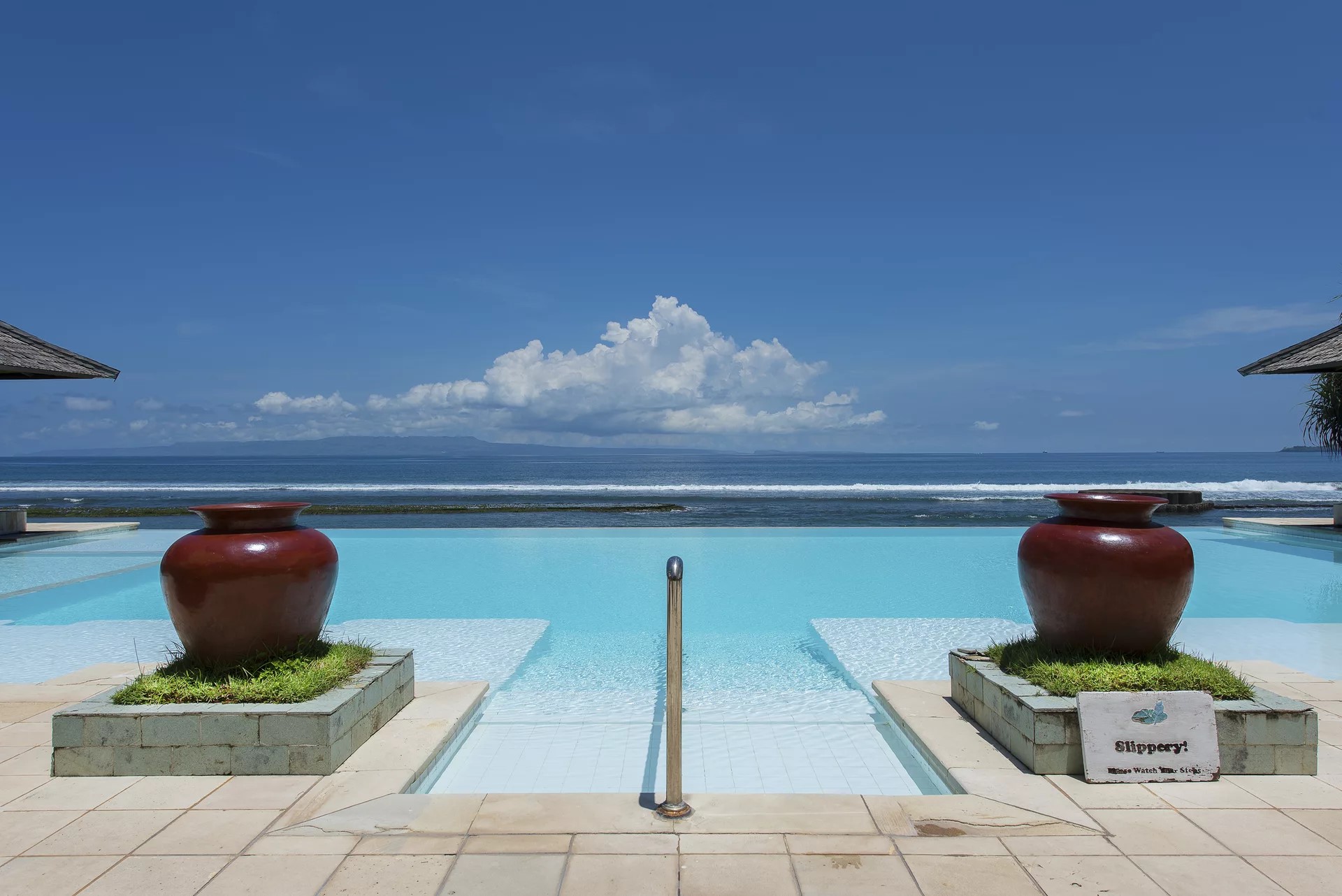 View from the infinity pool in Lotus Bungalows with the ocean in the background