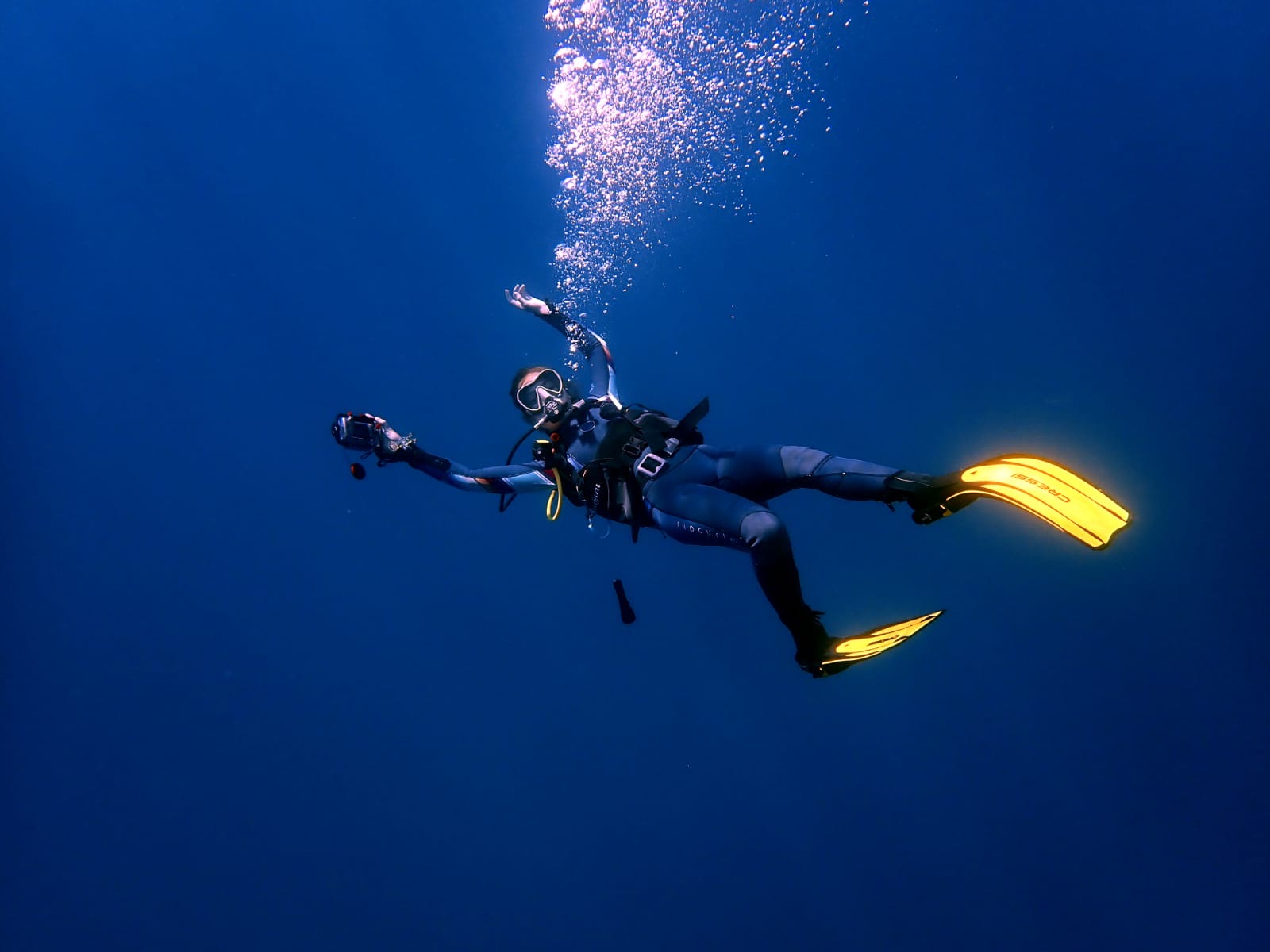 Samantha Raines scuba diving in the deep blue.