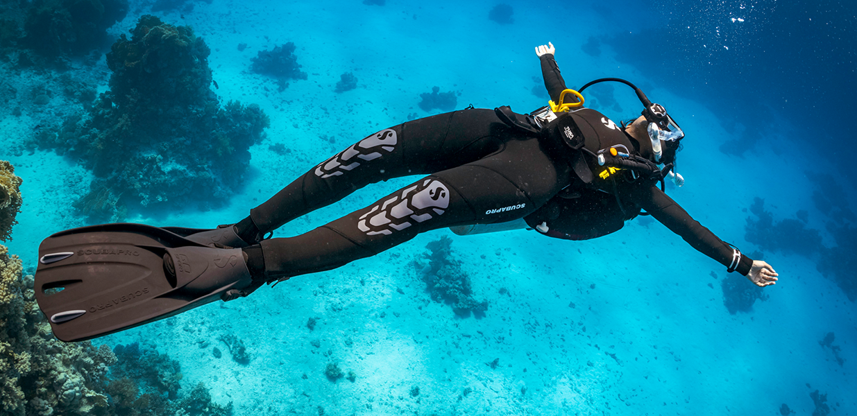 an underwater diver lying on their back