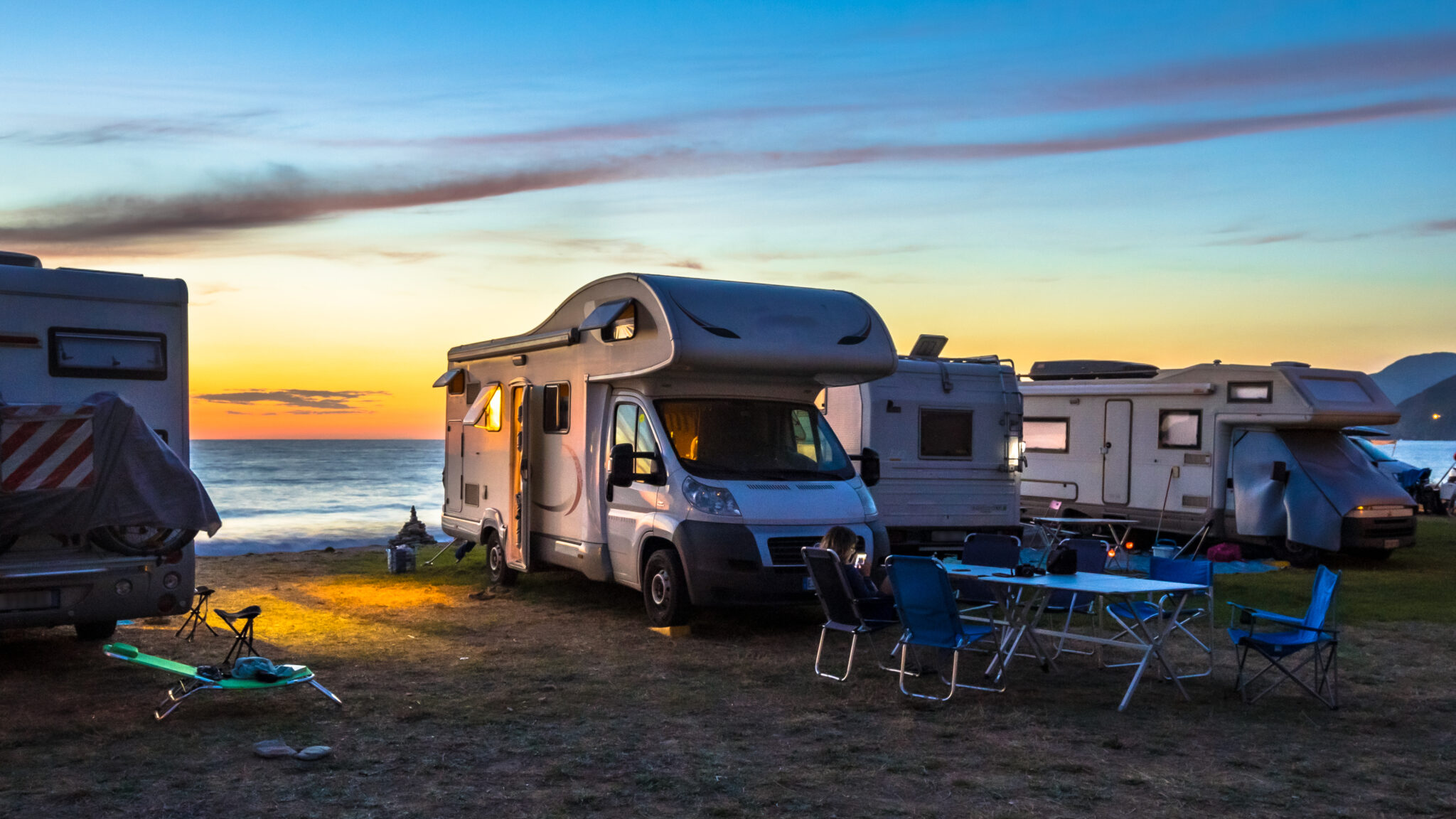 camper vans on the beach with a seaview, perfect for divers