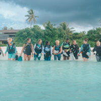 a row of women divers