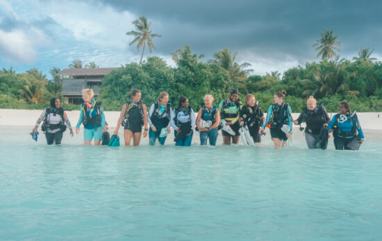 a row of women divers