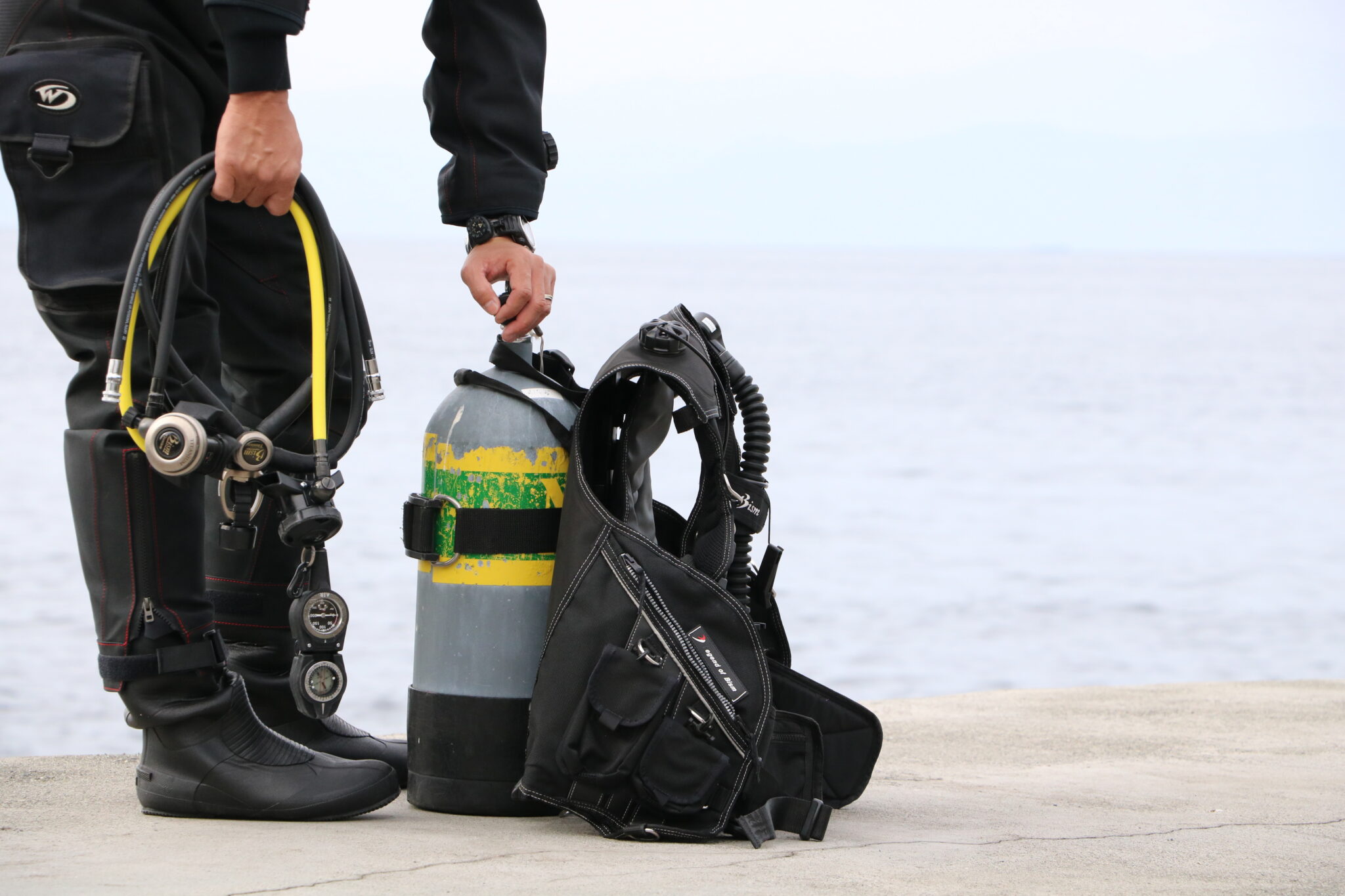 a diver setting diving equipment ready