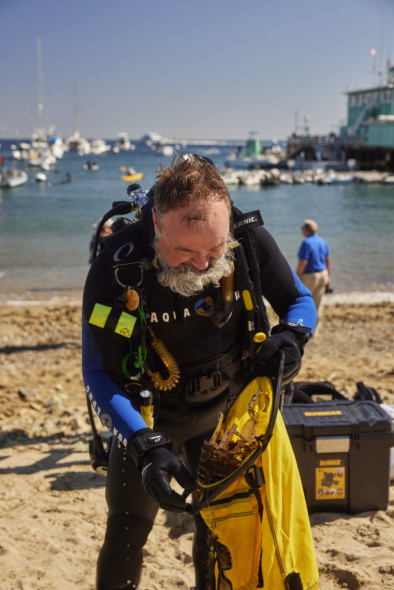 Grey bearded gentleman at the beach with his diving gear on